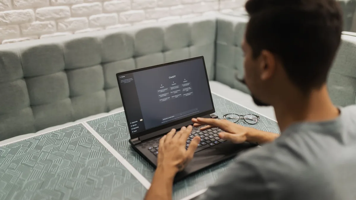 A person using an AI assistant on a laptop